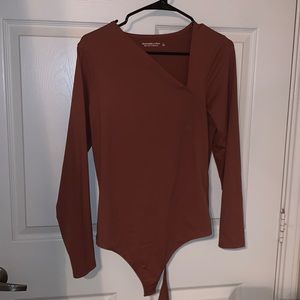 Brown long sleeve body suit.